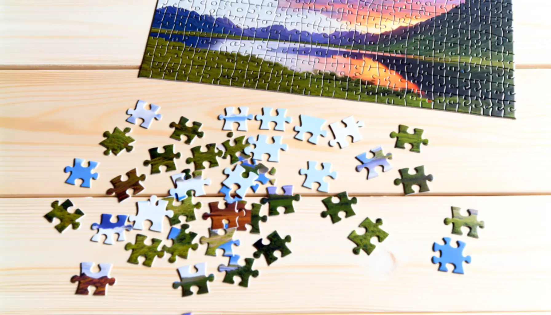 jigsaw-puzzle-pieces-on-wooden-table-6704.webp